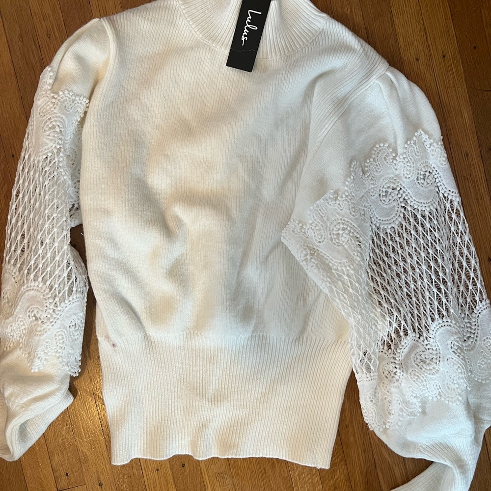 White sweater with lace arm trim